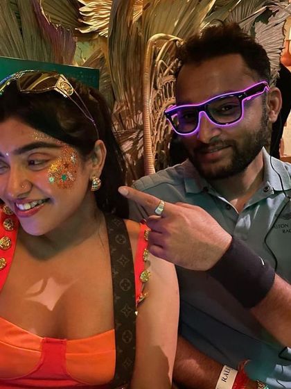 A fun, colorful glitter design with orange and turquoise accents. This look is all about playful energy and good vibes.