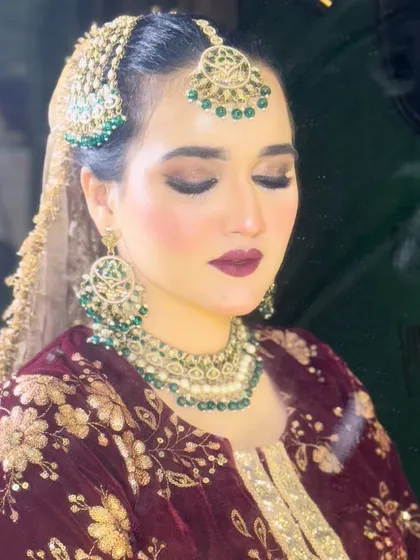 A close-up of the HD bridal look for this Nikkah ceremony. You can see the smooth, flawless finish of the base, the perfectly blended eyeshadow, and the sharp lip line, all essential for photo-ready makeup.