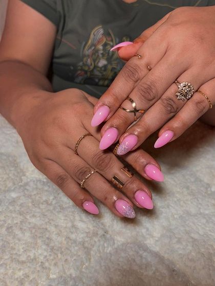 A pretty pink set with a solid color and a silver glitter accent nail for a touch of sparkle.