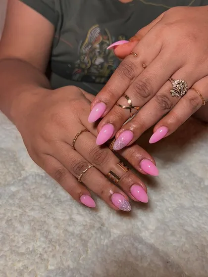 A pretty pink set with a solid color and a silver glitter accent nail for a touch of sparkle.