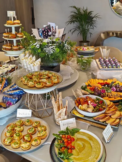 This is what a celebration looks like with Gourmetly Yours. Our grazing tables are a curated journey of flavors, featuring everything from savory tarts and dips to fresh fruits and gourmet cheese platters, ensuring there is a delightful bite for every guest.