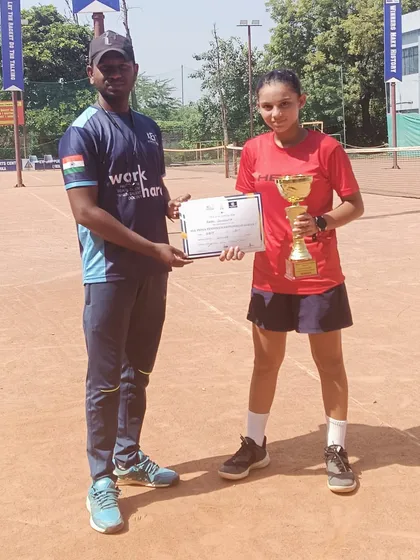 Our student receiving her winner's trophy. We are proud of her hard-fought victory.