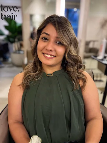 The happy client with her "butter Pinterest hair." This bronde balayage features a beautiful money piece that brightens her complexion.