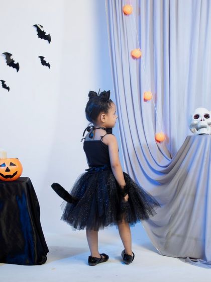 The back view of the black cat costume, showing the tail detail.