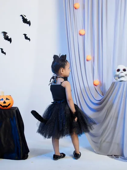 The back view of the black cat costume, showing the tail detail.