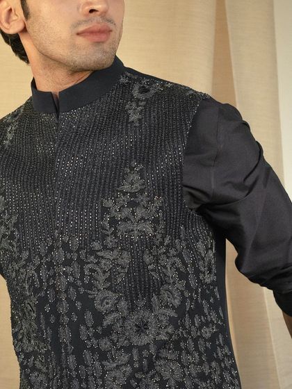 Elegance woven in every thread. This raw silk jacket with tonal embroidery exudes a rustic charm and effortless luxury.