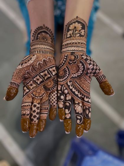 This is the final look of the design from the video where I was applying it. You can see the mix of floral bands, checks, and a beautiful lotus motif on the wrist.