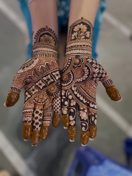 This is the final look of the design from the video where I was applying it. You can see the mix of floral bands, checks, and a beautiful lotus motif on the wrist.