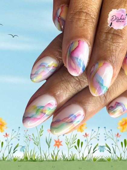 When your nails look like a summer morning. This beautiful watercolor design features a blend of soft pastel colors.