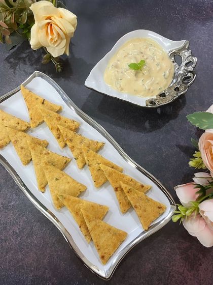 An elegant shot of my new savory offering, Snappers with Caramelized Onion Dip. These are perfect for parties or as a sophisticated snack.