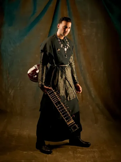The 'Sitar for Mental Health' tour is my Met Gala. This look, featuring a custom outfit and a handmade sitar, shows the level of artistry and intention I bring to every performance.