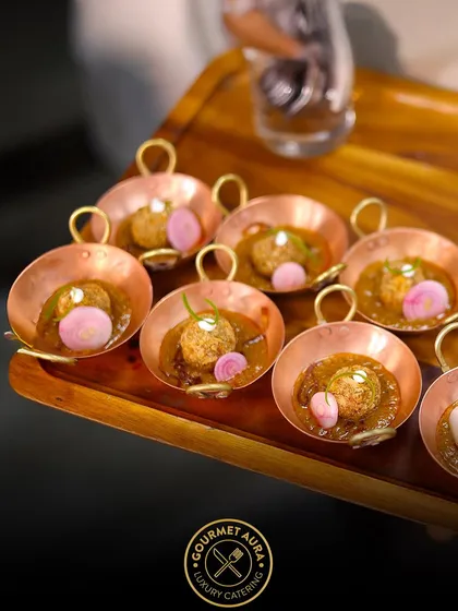 A modern take on Indian tradition. Individual portions of a rich, savory curry are served in elegant, handled copper bowls, ready to delight guests. We believe presentation is just as important as flavor.