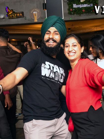 A happy couple enjoying the Punjabi beats at Sarjapur Social. It's awesome to see people from all backgrounds connect over music.