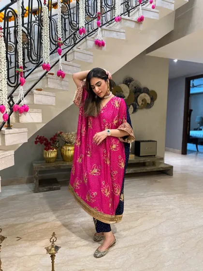 Adjusting my hair while showing off my Diwali look. The gold detailing on the sleeves adds a touch of festive sparkle.