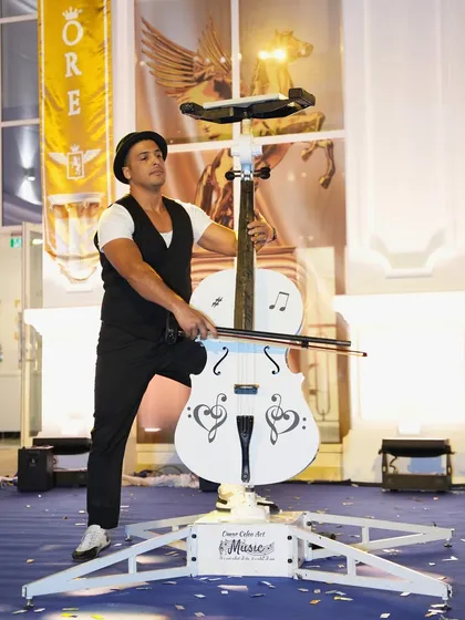 A unique cello stunt act, where the performer balances and plays the instrument in unconventional ways, providing a surprising and impressive show for guests.