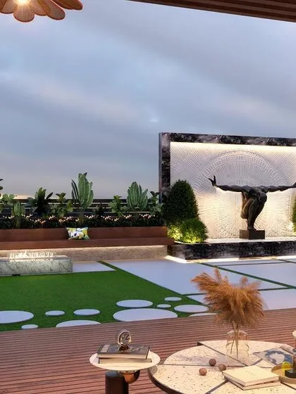 This angle showcases the grand water feature with a central sculpture, acting as a dramatic focal point for the terrace. The built-in seating and modern stepping stones across the lawn add layers of texture and functionality.