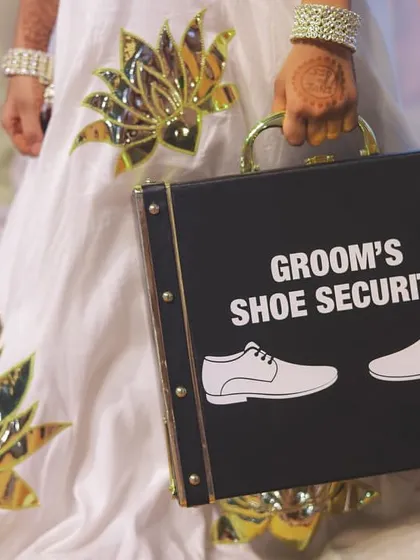 The 'Groom's Shoe Security'! A hilarious and creative detail that adds a layer of fun to the Jutta Chuppai ritual.