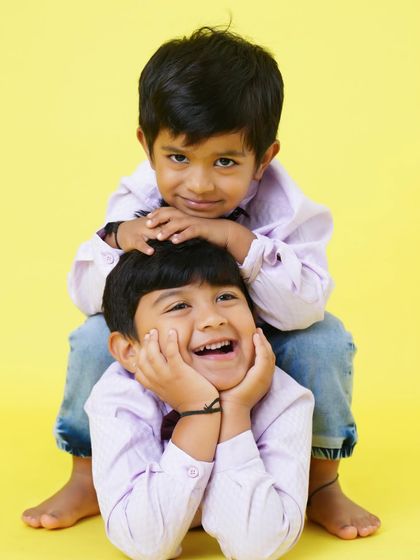The bond of brotherhood. A playful and loving portrait of two brothers having fun during their studio photoshoot.