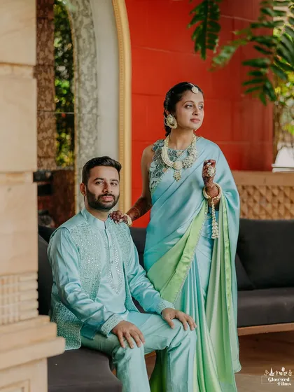 The couple looking serene and stylish in matching pastel blue outfits for their Haldi ceremony.