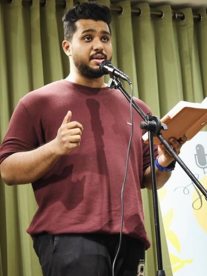 A storyteller mid-narrative at a "Speaking Souls" event.