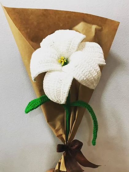 Another look at my classic white crochet lily. The attention to detail in the petals and stamen is something I take great pride in, ensuring each flower is a work of art.