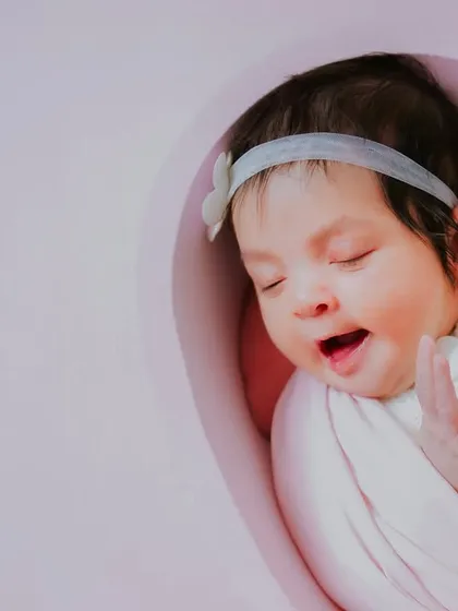 A sleepy yawn from a brand new baby girl. These unposed, real moments are what make newborn sessions so special.