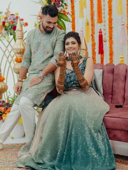 Another beautiful moment between the couple, with the bride showcasing her full-sleeve mehendi design.