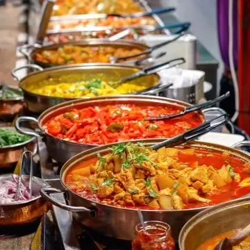 Another view of our colorful and diverse buffet line. We clearly label all dishes, including chicken, lamb, and vegetarian options, so guests can easily choose according to their preferences.