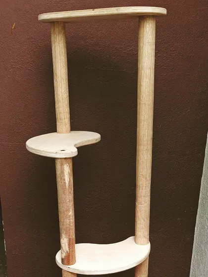 Another view of a cat tree in progress. This one is made from solid wood pillars and plywood platforms, designed to be both sturdy and stylish.