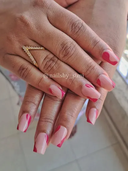 Pink soft swirl nails in a square shape. The abstract lines give it a modern and fun look.