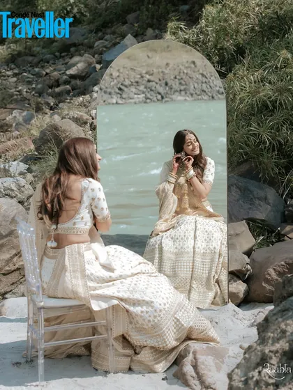 A moment of reflection for the bride, Shefali, by the Ganga in Rishikesh. We love using creative compositions, like this mirror portrait, to create artistic and meaningful bridal shots that feel like a page from a magazine.