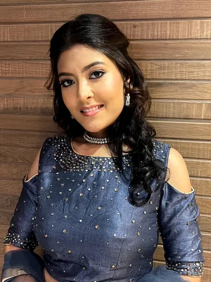 A simple yet elegant look for a pre-wedding function. The makeup is minimal, with a clean winged liner and a soft lip, perfect for a sophisticated evening.