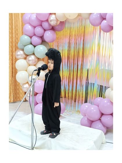 This performer, dressed as a black panther, commands the stage with a quiet intensity.