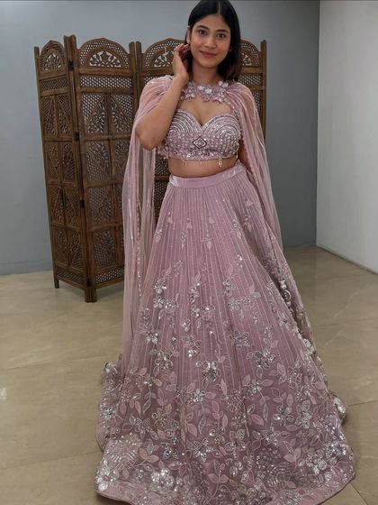 A happy client twirling in this beautiful cape lehenga. It’s designed to make you feel special.