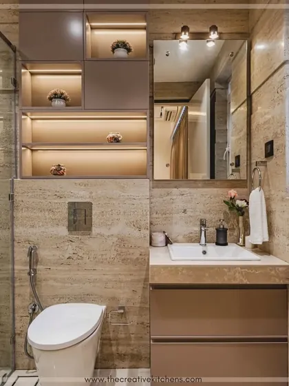 This striking monochromatic design turns a compact bathroom into a luxe, high-functioning space. The vanity and storage units are finished in a glossy PU, with integrated lighting in the shelves to add a warm glow.