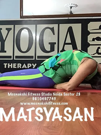 A clear demonstration of Matsyasana, a restorative backbend that helps relieve tension in the neck and shoulders.