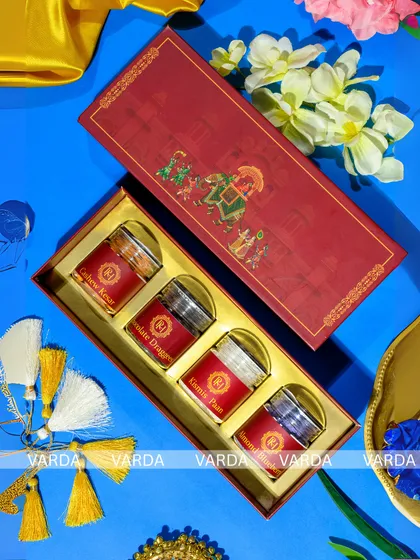 I bring grandeur to your celebration with this Royal Procession wedding gift box. The rich red and gold palette, combined with traditional Indian artwork, offers a truly regal unboxing experience for your guests.