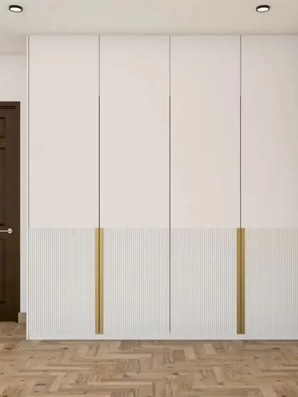 This two-tone wardrobe design combines a smooth white finish with a lower fluted panel section, creating a balanced and stylish look.