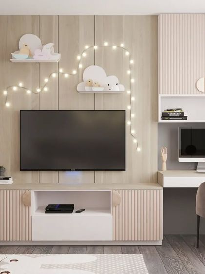 A multi-functional kid's room with a TV and entertainment unit, a compact study desk, and a small indoor gym area with a climbing wall and rings.