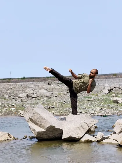 My signature kick at Kasarsai Dam. Balancing on an uneven surface while executing a precise kick tests core strength and focus.