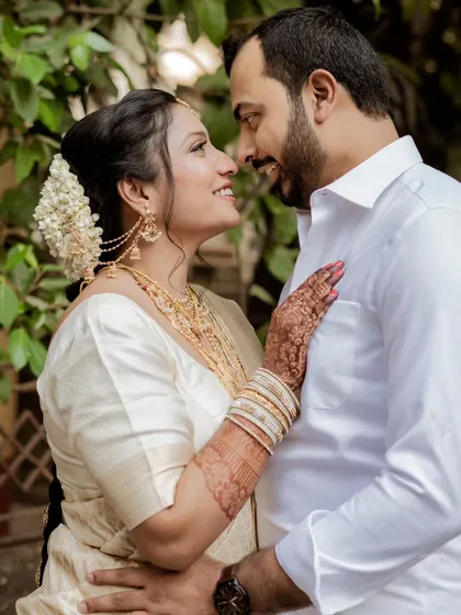 A romantic gaze between the couple. This portrait is all about the connection in their eyes, a silent conversation of love and commitment on their wedding day.