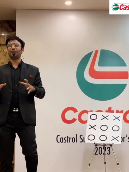 Playing a game of mental tic-tac-toe with the audience at a Castrol Sub Distributor's Meet. It's an interactive and fun way to demonstrate the power of prediction.