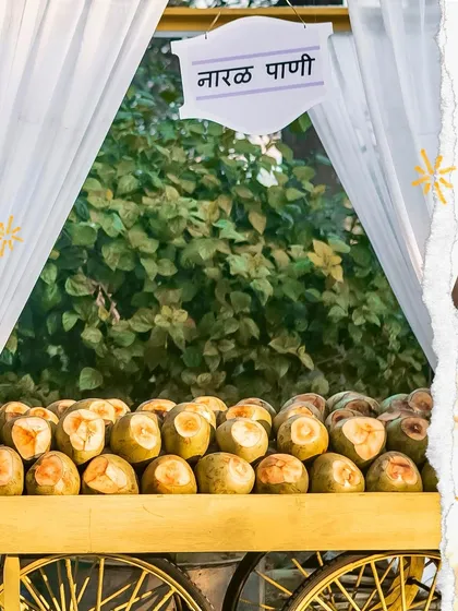A close up of my 'Nariyal Pani' cart, stocked with fresh coconuts. The simple, rustic setup adds an authentic and charming touch to any event.