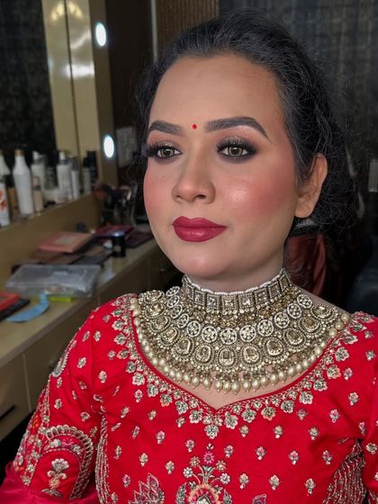 A bold red lip can instantly elevate a look. Here, the same eye makeup is paired with a different lip color for a more dramatic effect.