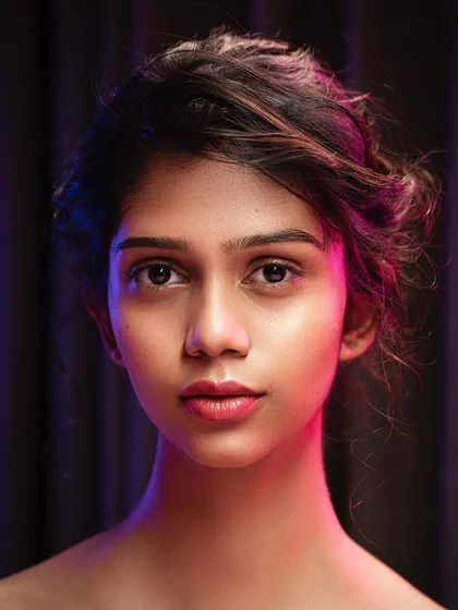 Experimenting with light is one of my favorite things to do in the studio. For this portrait, I used colored rim lighting to add dimension and a unique mood. This technique is perfect for creating artistic portraits that stand out from standard headshots.