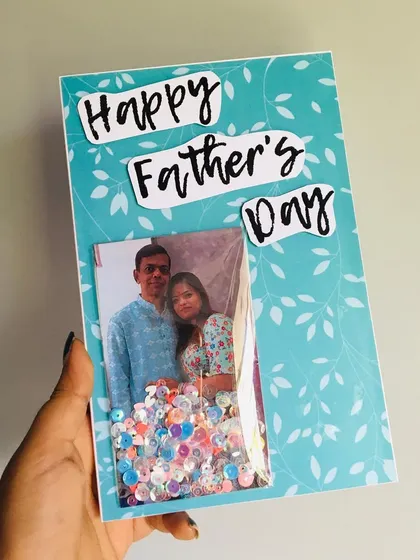 A special shaker greeting card for Father's Day, with a photo window filled with sequins.