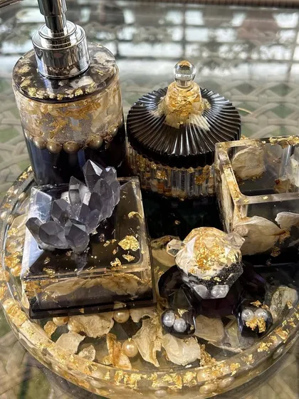 Another view of the black and gold bathroom organizer set. Each piece is handcrafted with care, turning everyday items into beautiful pieces of decor.