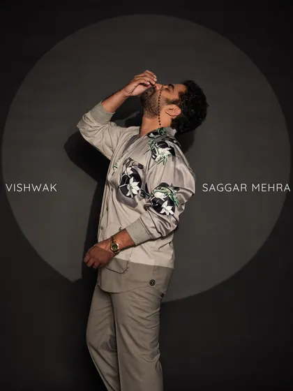 Vishwak Sen in my Ethereal Suit. This bespoke piece features a unique cross-pattern design with a floral printed satin sleeve, meticulously hand-stitched buttonholes, and is paired with straight accent pants.