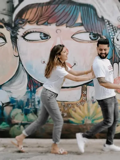 A fun and quirky shot of Harman and Komal in front of colorful street art in Phuket. It shows that we can find amazing photo opportunities anywhere, not just in nature.