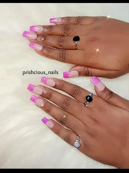 Another angle of the pink marble French tips. This is a great way to add a pop of color and pattern to a classic style.